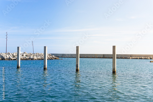 Landscape with cement pillars with background measurement in the bathing area at the Forum in Barcelona