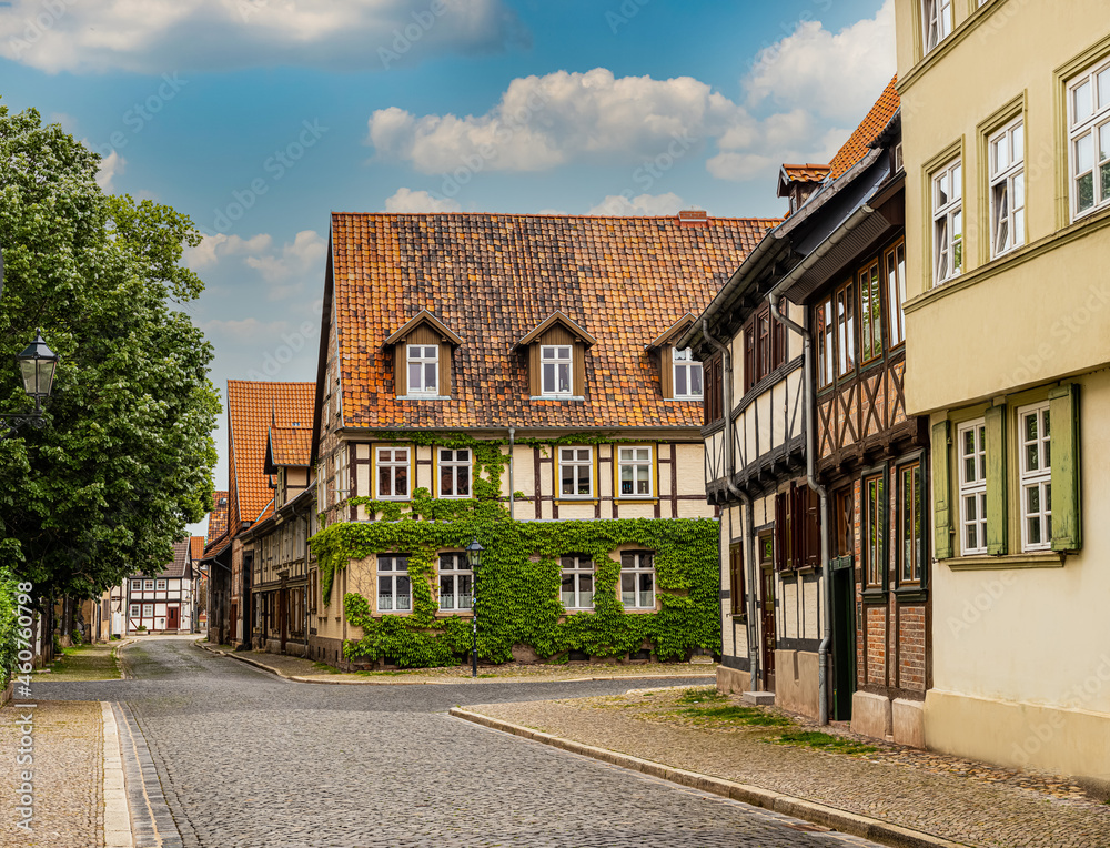 Quedlinburg,Saxony-Anhalt, Germany. 06 July 2021. small town with old vintage small colored houses and old cobblestone pavement. UNESCO World Heritage city Quedlinburg,Saxony-Anhalt, Germany. 06 July 2021. small town with old vintage small colored houses and old cobblestone pavement. UNESCO World Heritage city