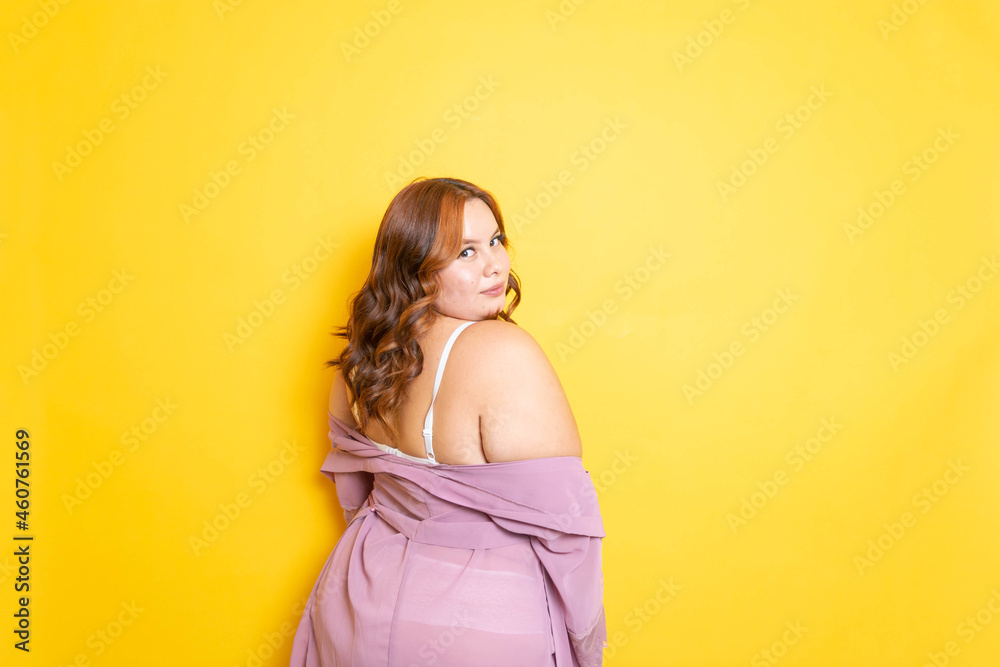 Sexy plus size young woman in lingerie with sensual pose from behind in  silk robe Stock Photo | Adobe Stock