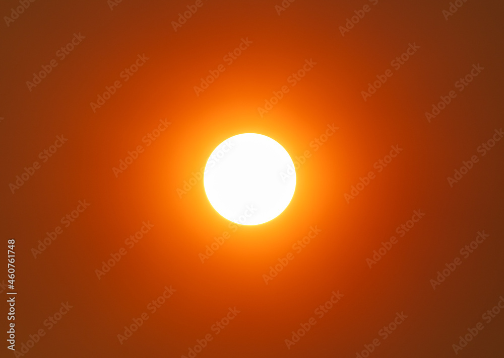 The sun in the sky in the smoke from the fire. The sun in the sky in the smoke from the fire.