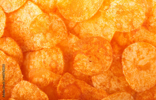 Red paprika potato chips screen filling closeup background 