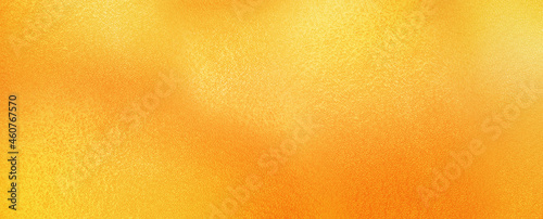 Metallic yellow orange golden foil texture. Vibrant yellow orange foil background.