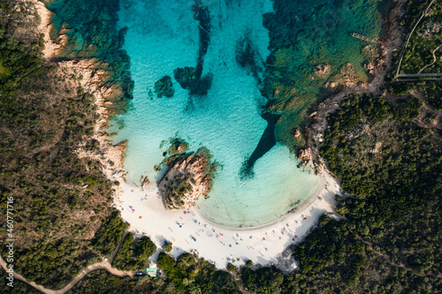 Obraz na płótnie View from above, stunning aerial view of a green coast with the beautiful Prince Beach (Spiaggia del Principe) a white sand beach bathed by a turquoise water. Sardinia, Italy. w salonie