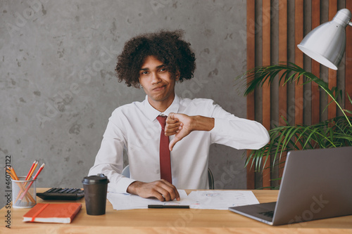 Fotografia Young sad displeased dissatisfied african american employee business man in clas