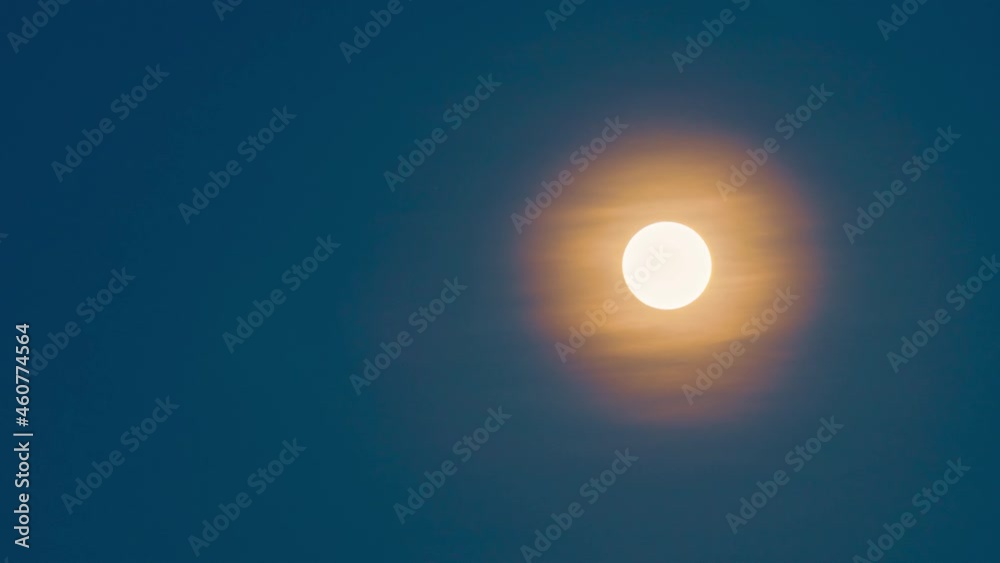 Full moon setting on sunrise in the blue sky . 4K time-lapse Full moon setting on sunrise in the blue sky . 4K time-lapse