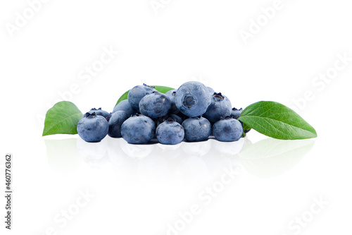 Blueberry berries with green leaves on a white background isolated.