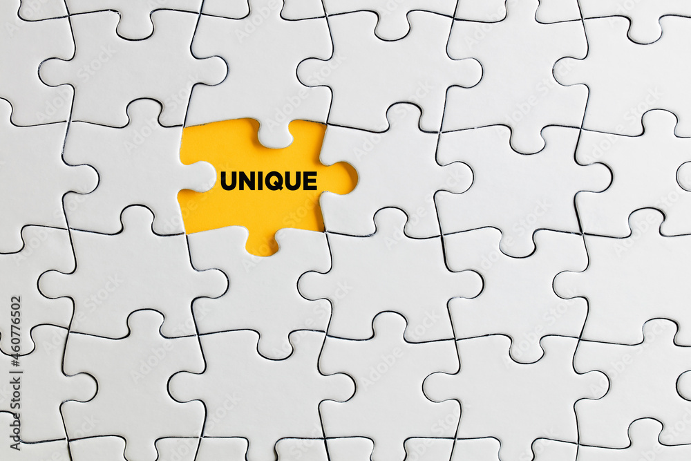 The word unique written on missing puzzle piece. Individuality, difference or diversity The word unique written on missing puzzle piece. Individuality, difference or diversity