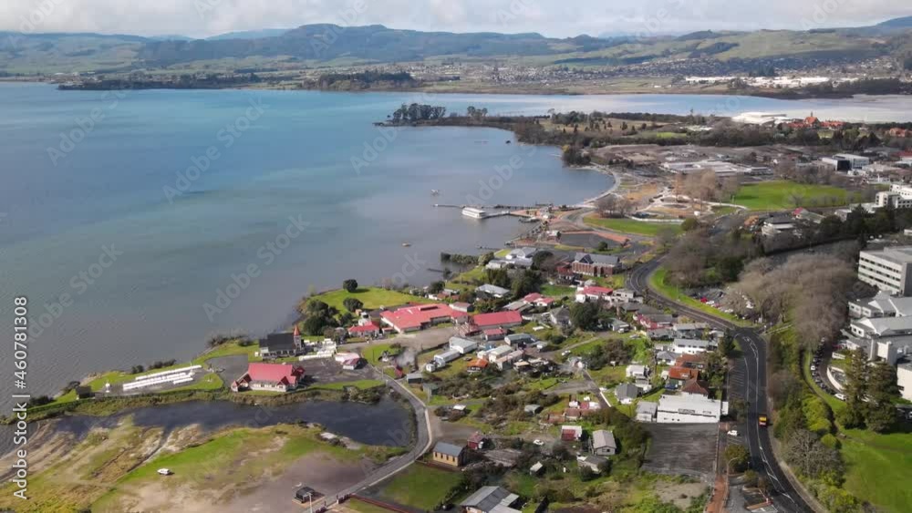 Aerial scenic view of fakefront of Lake Rotorua and Ohinemutu village during sunny day, New Zealand Aerial scenic view of fakefront of Lake Rotorua and Ohinemutu village during sunny day, New Zealand