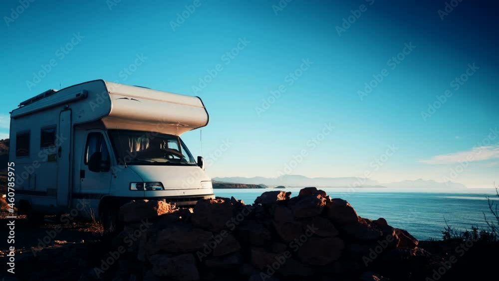 Camper vehicle camping by sea. Tour with motor home. Caravan vacation. Nature and activities. Camper vehicle camping by sea. Tour with motor home. Caravan vacation. Nature and activities.