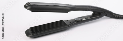 Foto Hair corrugation iron a on white background