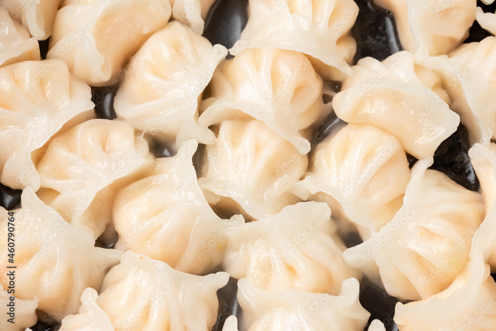 Traditional Asian Prawn or shrimp dumplings hakau, ha kauw or har gow. Served with cabbage, carrot salad and soy and sweet chilli sauce