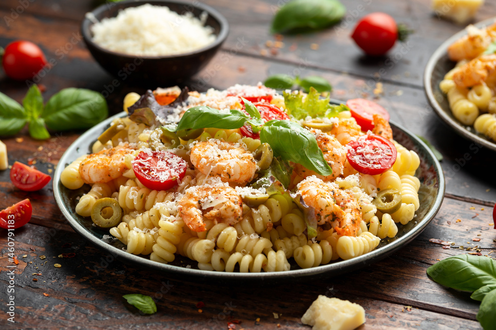 Prawn pasta salad with marinated green olives, cherry tomatoes and parmesan cheese. Prawn pasta salad with marinated green olives, cherry tomatoes and parmesan cheese.