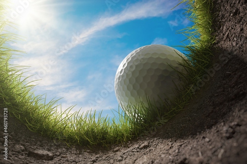 Golf ball is falling into hole. View from inside of hole. 3D rendered illustration. photo