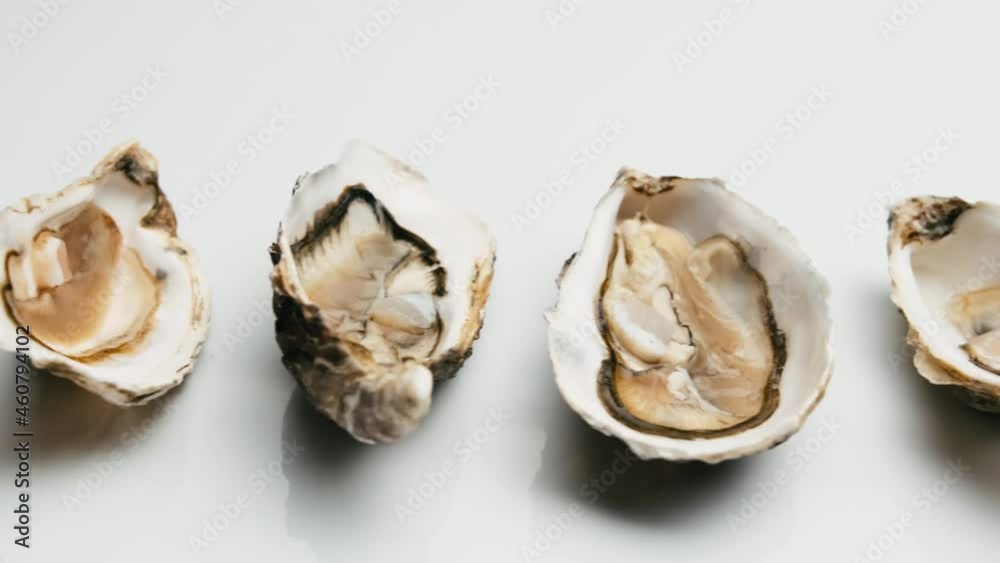Luxury fresh raw oysters isolated on white background. French marine delicatessen Luxury fresh raw oysters isolated on white background. French marine delicatessen
