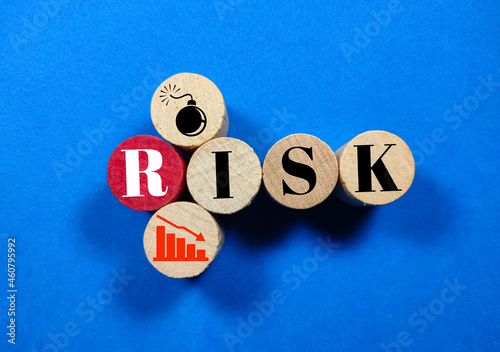 Wooden block cylinder,risk icon with the word risk. Business concept