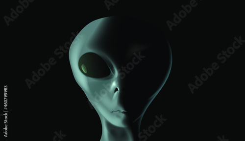 Alien's face on black background. UFO and extraterrestrial life concept.