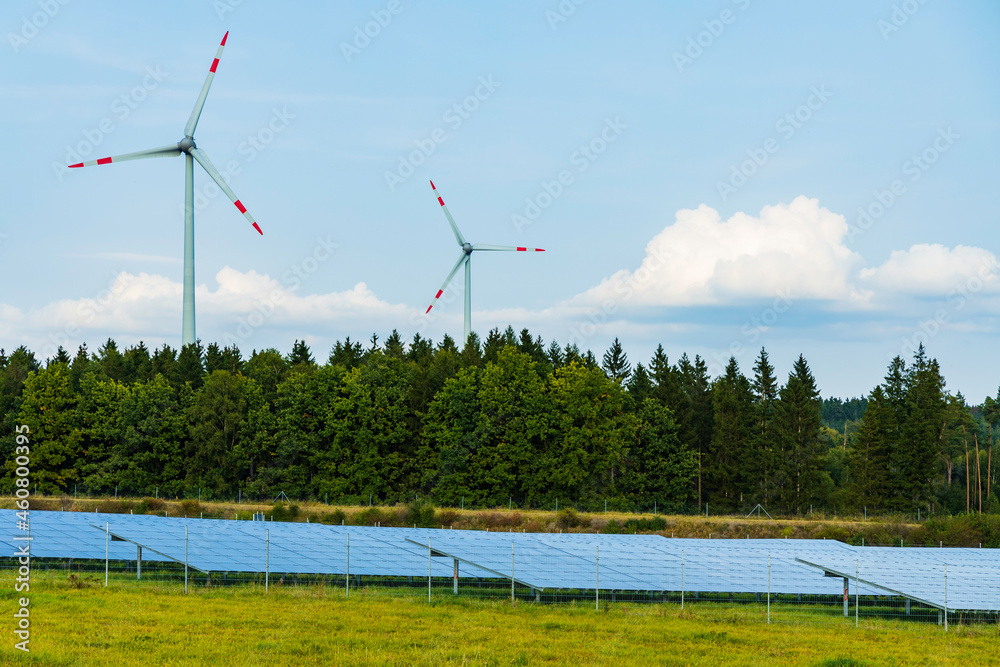 wind turbines and photovoltaic solar panels in the rural landscape