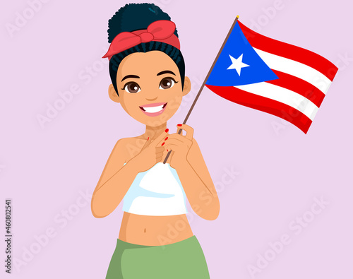 Beautiful Puerto Rican woman waving Puerto Rico Flag indicating with pointing finger hand gesture