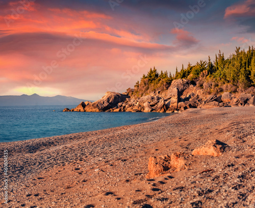 Start of the vacation season. Warm summer evening on Livadhi beach, Himare village location. Amazing sunrise in Albania. Incredible seascape of Adriatic sea. Beauty of nature concept background. photo