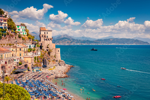 Fototapeta Naklejka Na Ścianę i Meble -  Gorgeous summer view of historical landmark - Torre di Cetara tower. Aerial morning cityscape of Cetara town. Beautiful Mediterranean seascape. Vacation concept background..