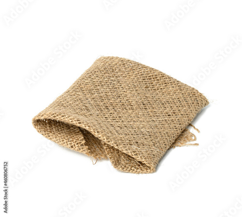 folded brown burlap fabric and isoleted on white background