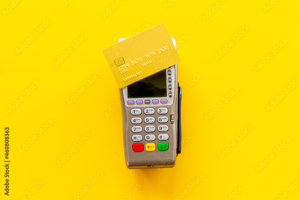 E-commerce and payment concept. Pos terminal with credit cards top view