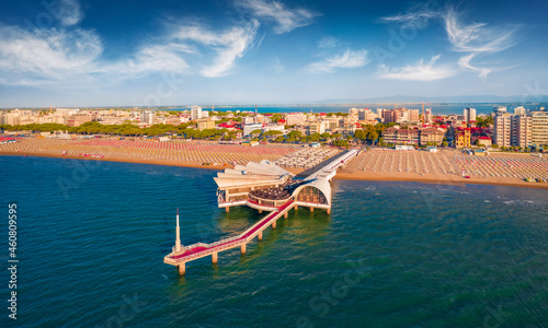 Fototapeta Naklejka Na Ścianę i Meble -  Empty beaches at early Auguast morning. Impressive summer cityscape of Lignano Sabbiadoro town. Magnificent outdoor scene of Adriatic coast of Italy, Europe. Aerial landscape photography..