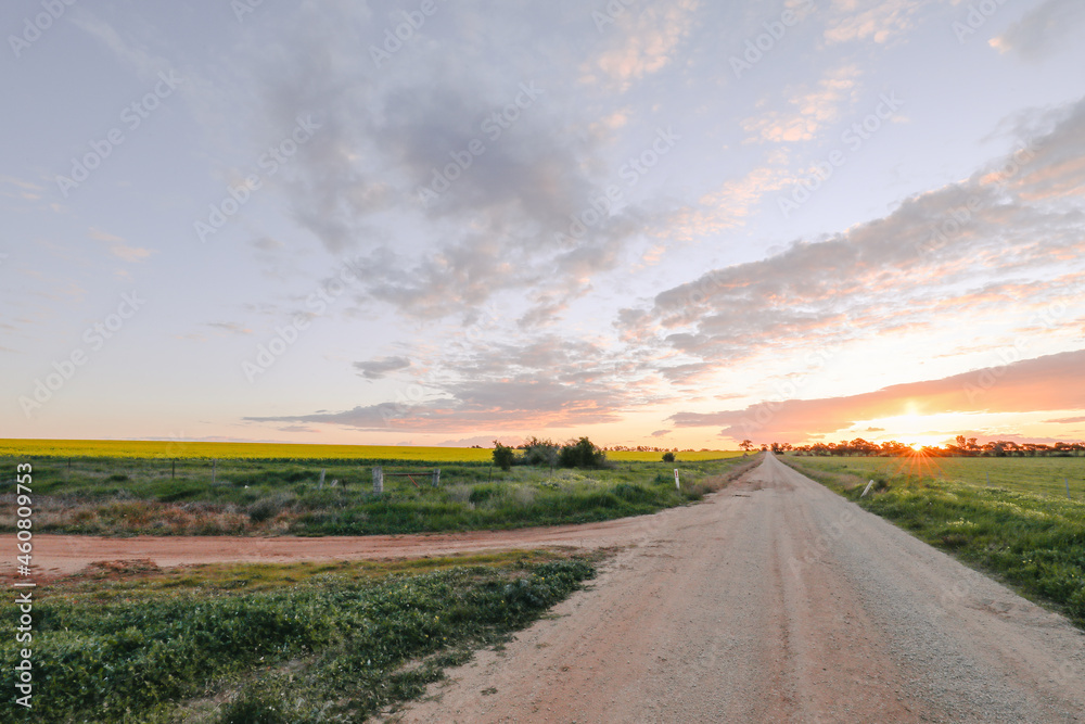 Sun setting on country road in Central Victoria, Australia. Late afternoon in Australia. Sun setting on country road in Central Victoria, Australia. Late afternoon in Australia.