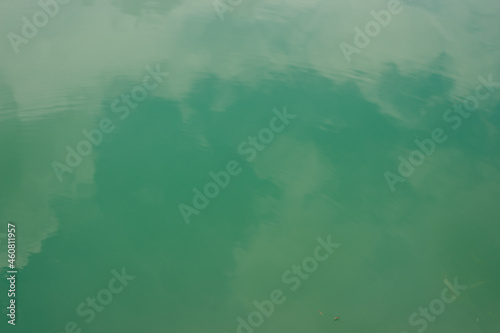 background image of sky and clouds reflected from water