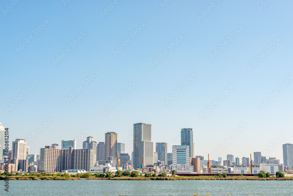 View of office buildings of central Osaka city from Yodogawa river bank