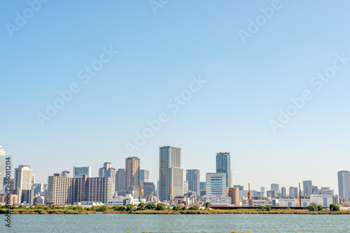 View of office buildings of central Osaka city from Yodogawa river bank