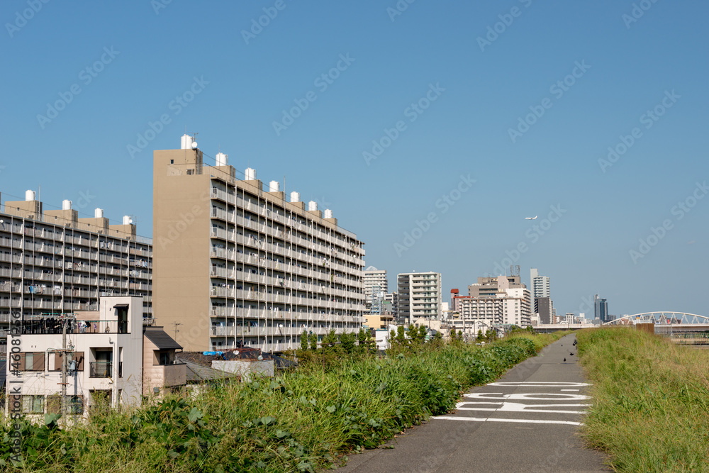 View of Yodogawa river bank road in Tsukamoto, Osaka, Japan View of Yodogawa river bank road in Tsukamoto, Osaka, Japan