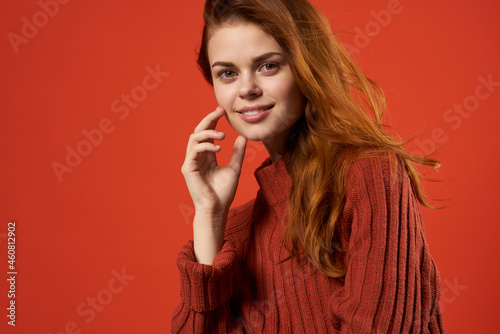 woman in red sweater fashion posing luxury glamor model