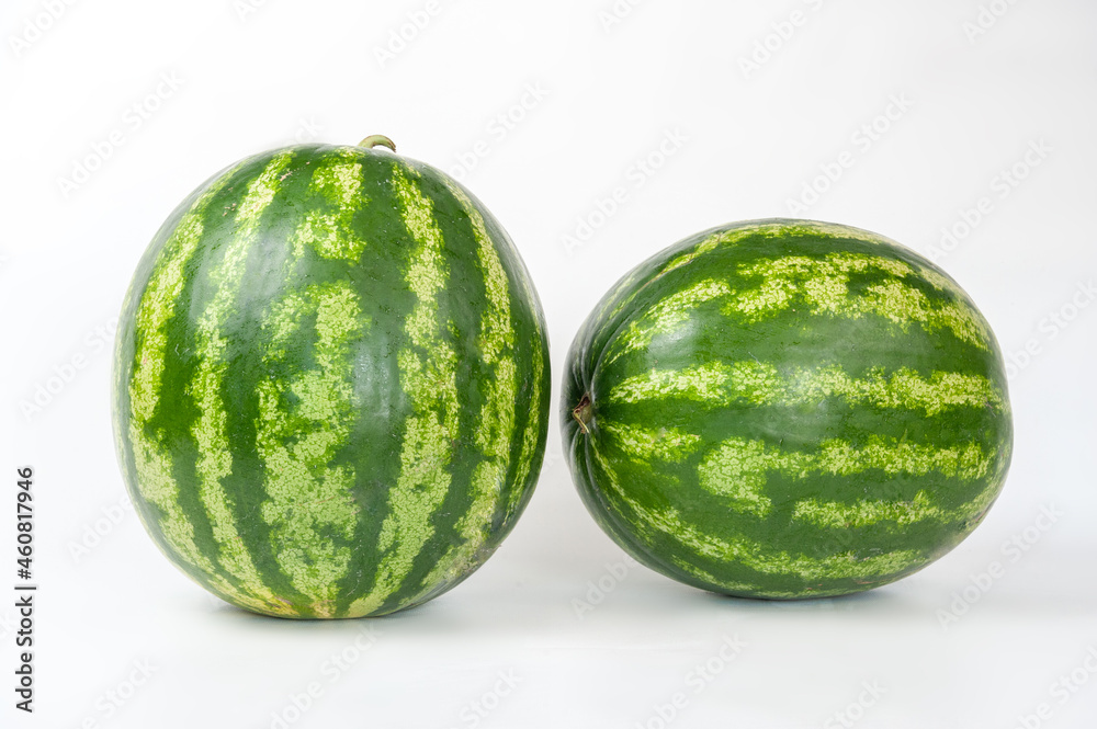 ripe watermelons on a white background and on melons ripe watermelons on a white background and on melons