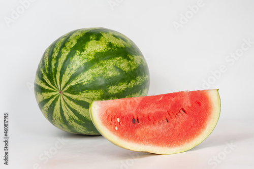 ripe watermelons on a white background and on melons