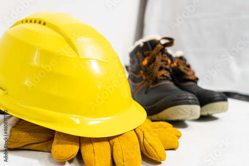 Construction helmet, gloves and shoes. Workwear.