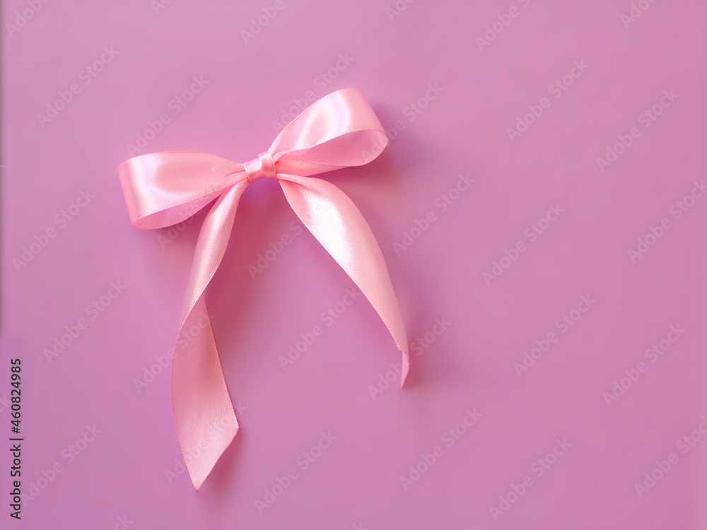 Pink satin bow on pastel pink background. valentine day greeting card with copyspace Pink satin bow on pastel pink background. valentine day greeting card with copyspace