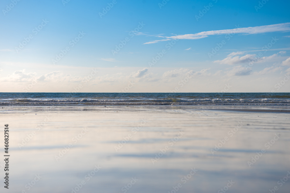 Fototapeta premium Reflection of beach and blue sky.