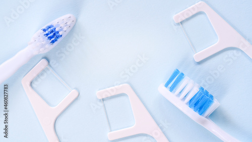 white-blue toothbrush and dental floss. Daily rituals in the morning concept
