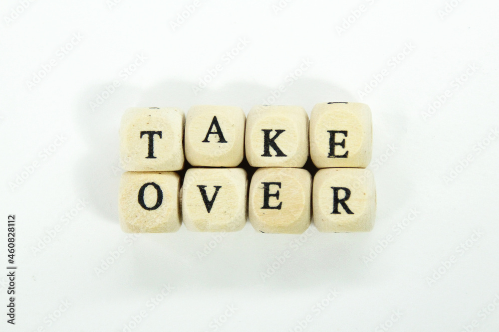 wooden cubes with the word Take Over wooden cubes with the word Take Over