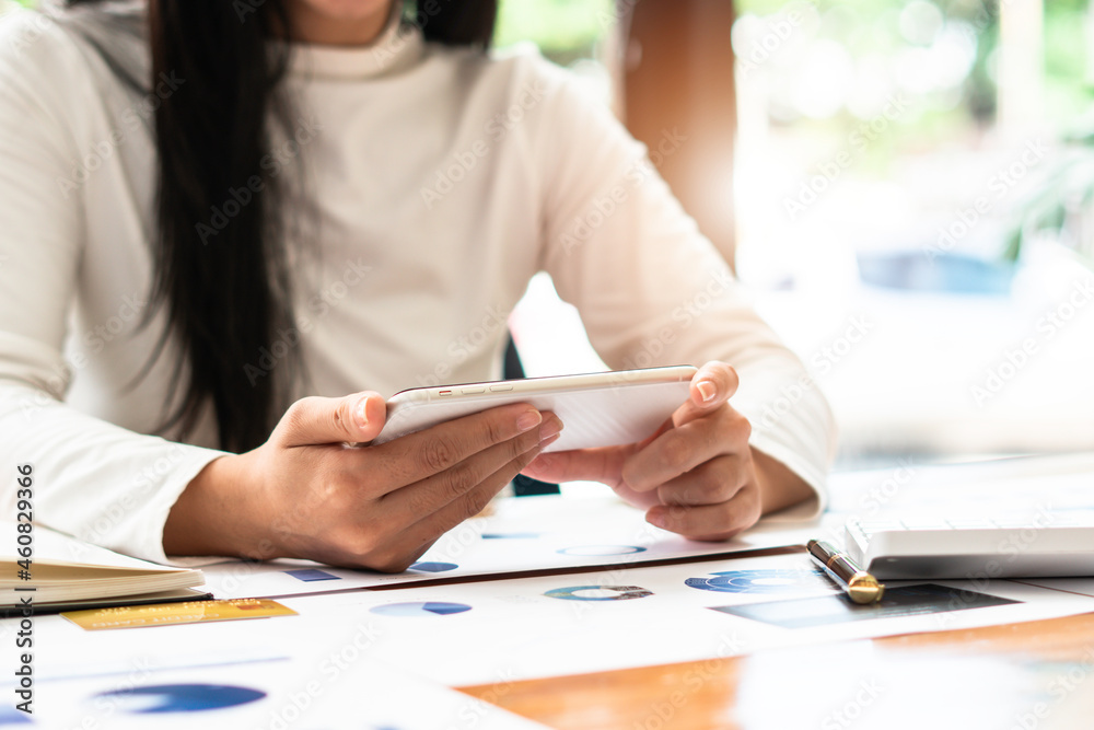 Woman using modern smartphone device, female hands typing text message via cellphone, social networking concept Woman using modern smartphone device, female hands typing text message via cellphone, social networking concept
