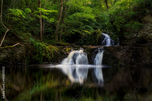 Beautiful waterfall in Forest. Long exposure. Selective focus.