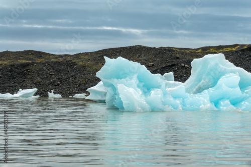 Icebergs in Fjallsarlon glacier lagoon, arctic landscape, Iceland