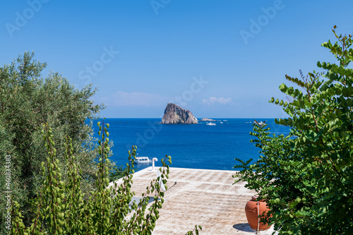 Panarea island (Aeolian archipelago), Lipari, Messina, Sicily, Italy, 08.21.2021: panoramic view  with Dattilo's rock in the background. © Giongi63