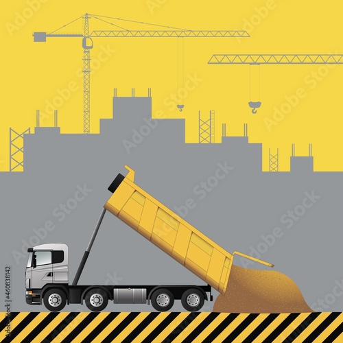Dump truck. Construction machinery on the background of a building under construction.