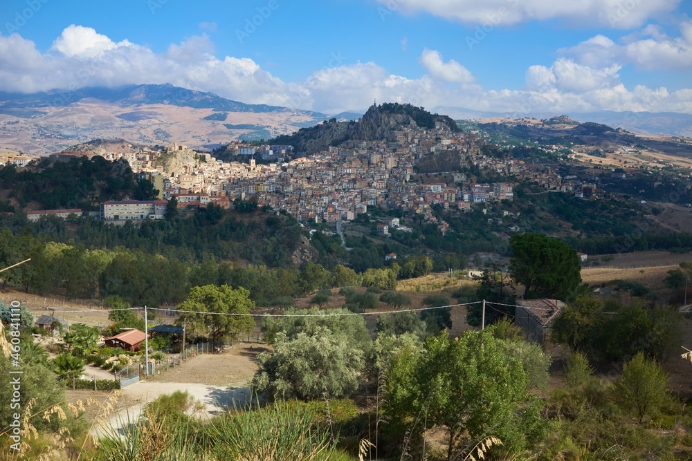 the town of Nicosia in the province of Enna, in Sicily, between its countryside and its hills on a late summer day
