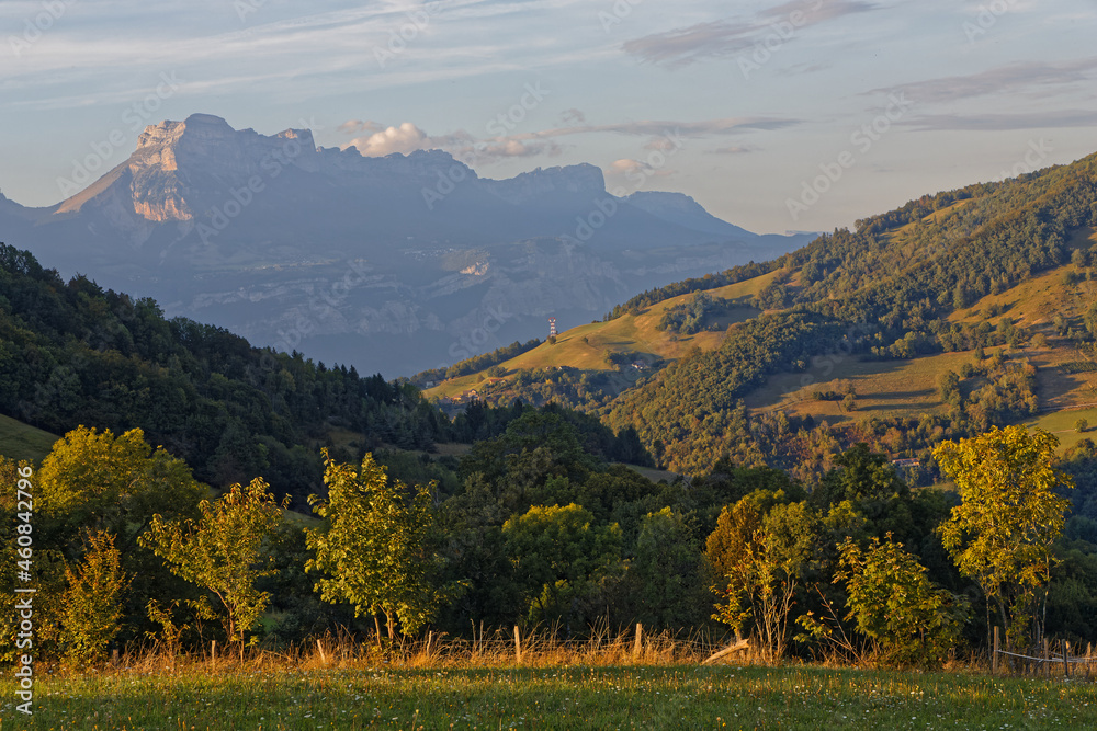 Meadows and moutain landscape in Belledonner mountain range just before sunset