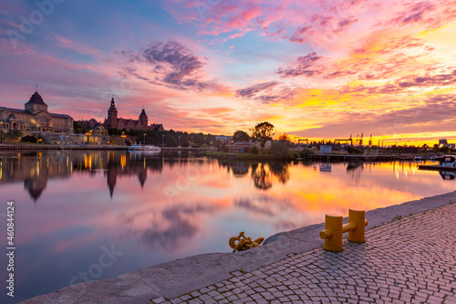 Panorama of Old town with reflection in river Oder at sunset, Szczecin, Poland