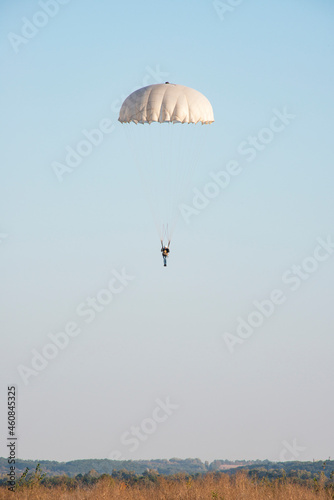 Skydiver activity sport jump on the blue sky background