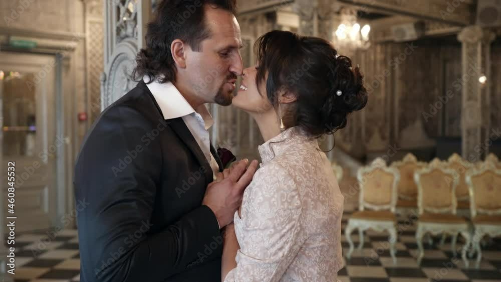 happy just married couple in restaurant, wedding day in luxury interior, emotional bride and groom happy just married couple in restaurant, wedding day in luxury interior, emotional bride and groom